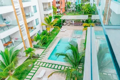 an overhead view of a swimming pool in a building at Apartamento en punta cana close to the beach in Punta Cana