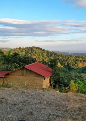 a building with a red roof on top of a hill at Mountain refuge - Cabin with wonderful views! in La Búcara