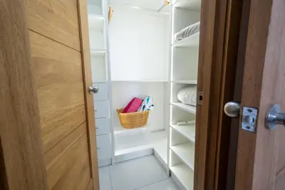 a walk in closet with a basket on the door at Rosa s Hidden Gem beach wifi in Los Corrales