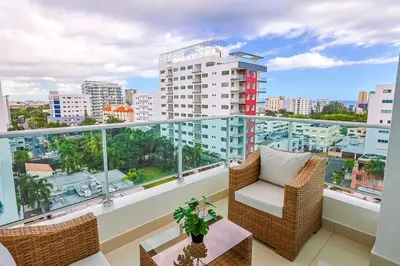 a balcony with a view of a city at Elegant Centric Apt Near all in Santo Domingo
