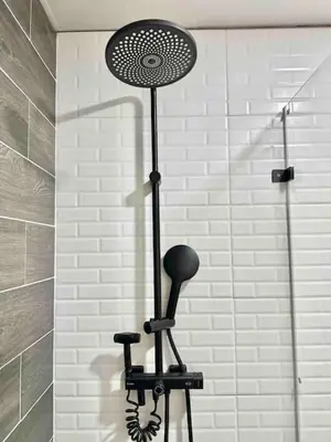 a shower with a fan on a stand in a bathroom at Cozy Beach Condo Great Views in Guayacanes