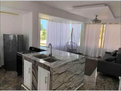 a kitchen with a sink and a counter top at Apart-hotel Central in Las Terrenas