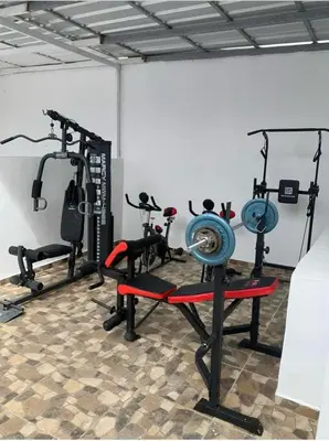 a gym with several tread machines in a room at Apart-hotel Central in Las Terrenas