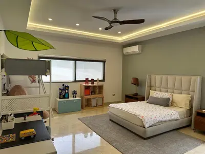a childs bedroom with a bed and a window at Villa paraíso in Juan Dolio