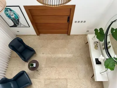 an overhead view of a living room with a table and chairs at Villa paraíso in Juan Dolio