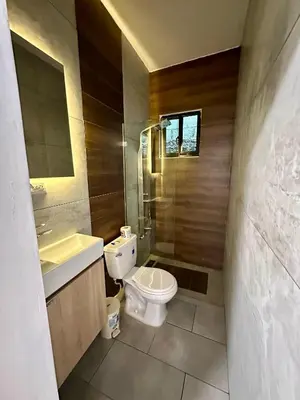 a bathroom with a toilet and a sink at Residencial Fe y Esperanza in Pedernales