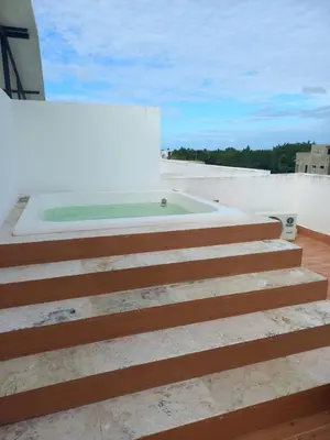 a swimming pool on the roof of a house at Apartamento en Vista Cana in Batey San Germán