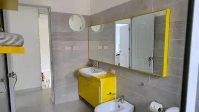 a bathroom with a sink and a mirror at Acogedora Casa privada in Bayahibe