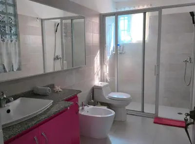a bathroom with a toilet and a sink and a shower at Acogedora Casa privada in Bayahibe