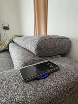 a remote control sitting on the edge of a couch at Terraza Caribeña in Bayahibe