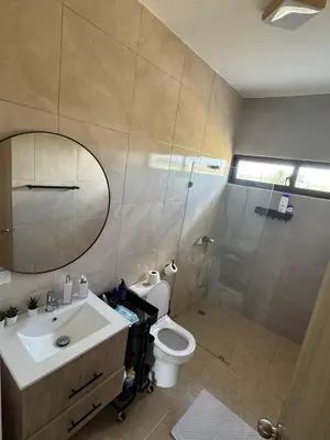 a bathroom with a toilet and a sink and a shower at Terraza Caribeña in Bayahibe