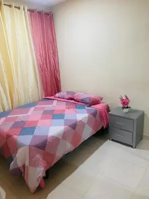 a bedroom with a bed and a dresser and a window at Apartamento Familiar 7 in Colorado
