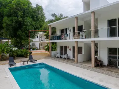 a villa with a swimming pool and a house at El Patio de Lucia Residencia in Las Terrenas