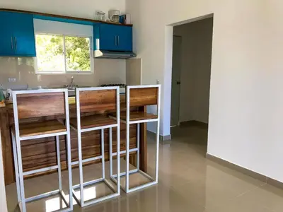 a kitchen with blue cabinets and a counter top at Colina Residence in Las Terrenas