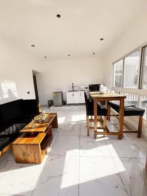 a living room with a couch and a table at Colina Residence in Las Terrenas