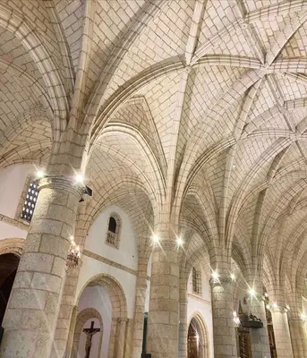 a large building with a vaulted ceiling with lights at Lovely apartment colonial zone in Santo Domingo