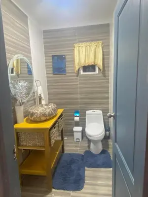 a bathroom with a toilet and a sink at Lovely apartment colonial zone in Santo Domingo
