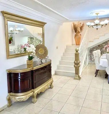 a living room with a dresser and a mirror at Casa con piscina Romana del Oeste in La Romana