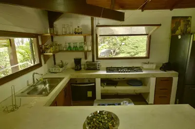 a small kitchen with a sink and a window at Villa Jimi Las Terrenas in El Naranjito