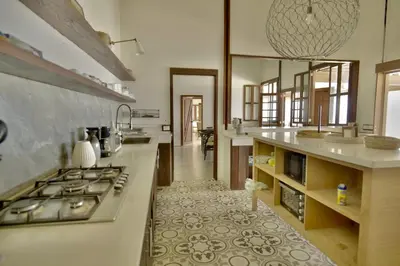 a kitchen with a stove and a counter top at Villa Lukner Las Terrenas in Las Terrenas