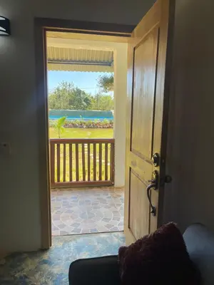 an open door with a view of a balcony at Habitacion 1 en Dani's Guest House in Las Galeras