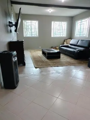 a living room with a couch and a table at Villa Magante in La Yagua
