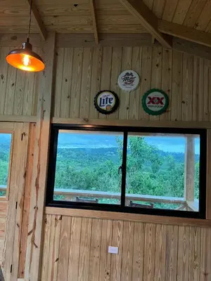 a room with a window in a wooden wall at Villa con piscina Infinitive in Concepción de La Vega