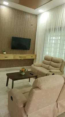 a living room with two couches and a flat screen tv at Villa con piscina Infinitive in Concepción de La Vega
