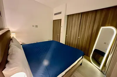 a small room with a bed and a window at Adult Only Luxe Retreat @ Coral Bay 2 in Punta Cana