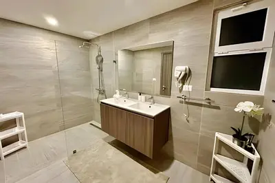 a bathroom with a sink and a mirror at Adult Only Luxe Retreat @ Coral Bay 2 in Punta Cana
