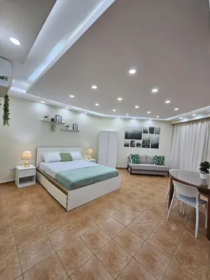 a large bedroom with a bed and a table at Jardines del Mar Todas las Amenidades Reserva Inmediata in Villas del Mar