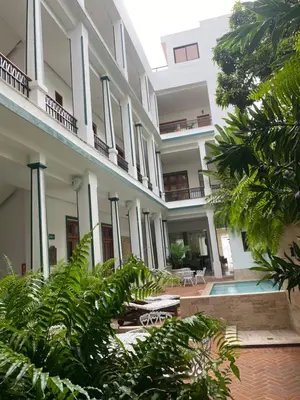 an external view of a building with plants at Boutique Hotel Casa Grande, Banana Chica, Estudio superior con cocina in Santo Domingo