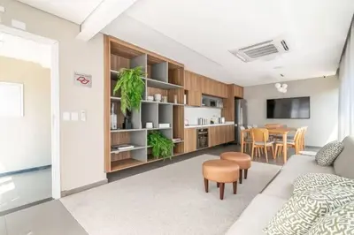 a living room with a couch and a dining room at Luxury Apartment in Santo Domingo