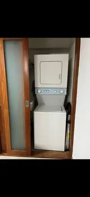 a microwave sitting on top of a refrigerator at Luxury Apartment in Santo Domingo