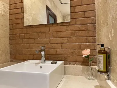 a bathroom with a white sink and a mirror at Boutique Hotel Casa Grande, Tropical Journey, Suite familiar de 2 dormitorios in Santo Domingo