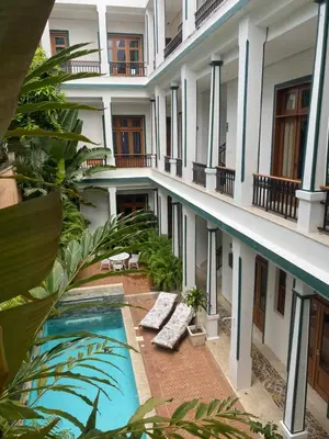 a view of the courtyard of a building with a swimming pool at Boutique Hotel Casa Grande, Tropical Journey, Suite familiar de 2 dormitorios in Santo Domingo