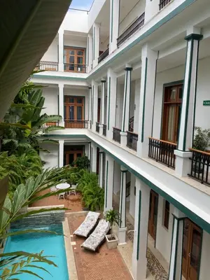 an external view of a hotel with a swimming pool at Boutique Hotel Casa Grande, Chocolate Paradise, Estudio superior con Cocina in Santo Domingo