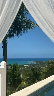 a view of the ocean from the balcony of a resort at Villa Blanca, Las Terrenas, 4 chambres in Las Terrenas