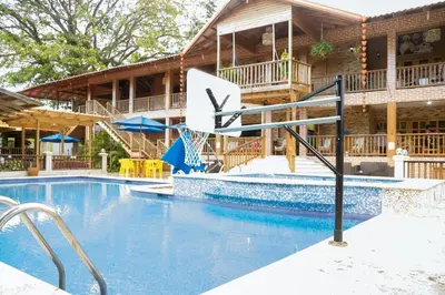 a large swimming pool in front of a building at Spectacular Country Villa in Pedro Brand