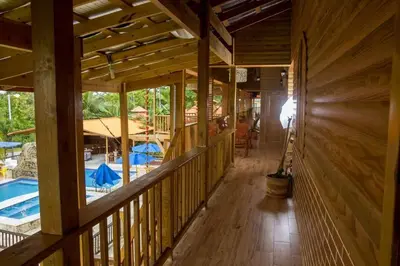an inside view of a wooden house with a pool at Spectacular Country Villa in Pedro Brand