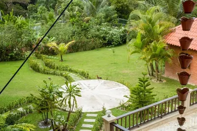 a view of a garden from the balcony of a house at Spectacular Country Villa in Pedro Brand