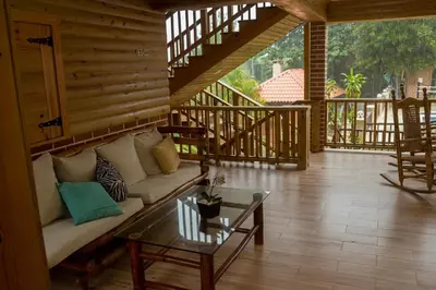 a living room with a couch and a table at Spectacular Country Villa in Pedro Brand