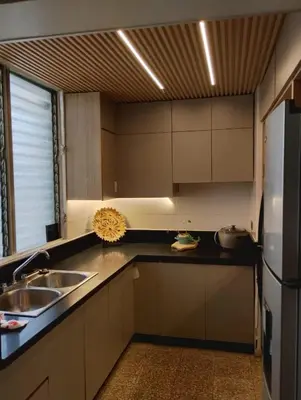a kitchen with a sink and a refrigerator at Comfortable apartment in Santo Domingo