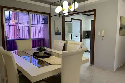 a dining room with a table and chairs at Sunshine Palmares de Caleta in La Romana