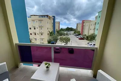 a balcony with a view of a parking lot at Sunshine Palmares de Caleta in La Romana