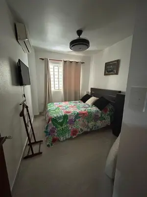a bedroom with a bed and a window at Luxury apartment Riviera Colonial in Calero