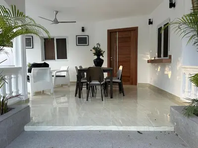a dining room with a table and chairs at mamajuana House in Las Terrenas