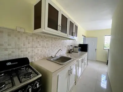 a kitchen with a sink and a stove at Apartamento Costero 3 en Las Galeras de Samaná in Las Galeras