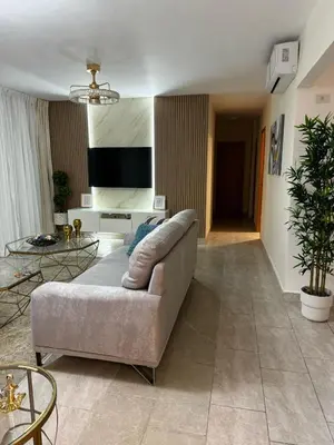 a living room with a couch and a tv at Modern Colonial Water View in Calero