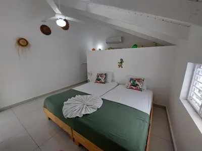 a bedroom with a bed in a white room at Canela House 3BR Near to the beach in Las Terrenas